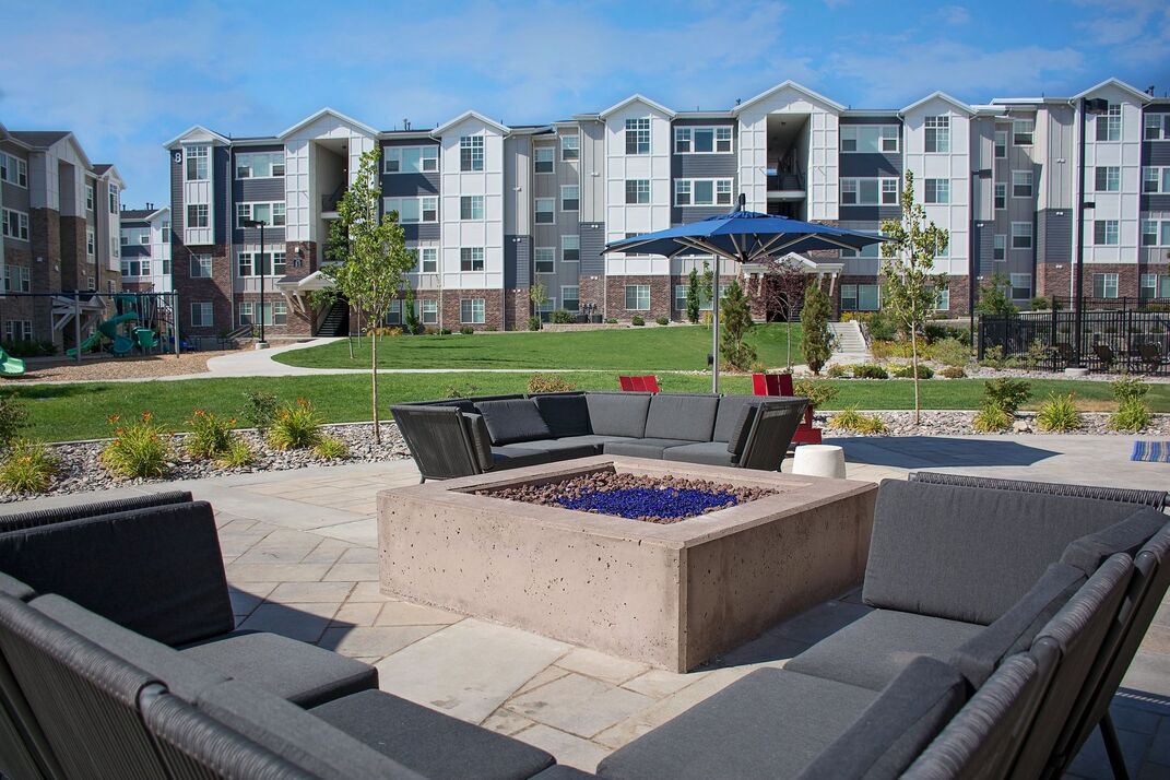 poolside area, 3 comfy chairs and a fire pit