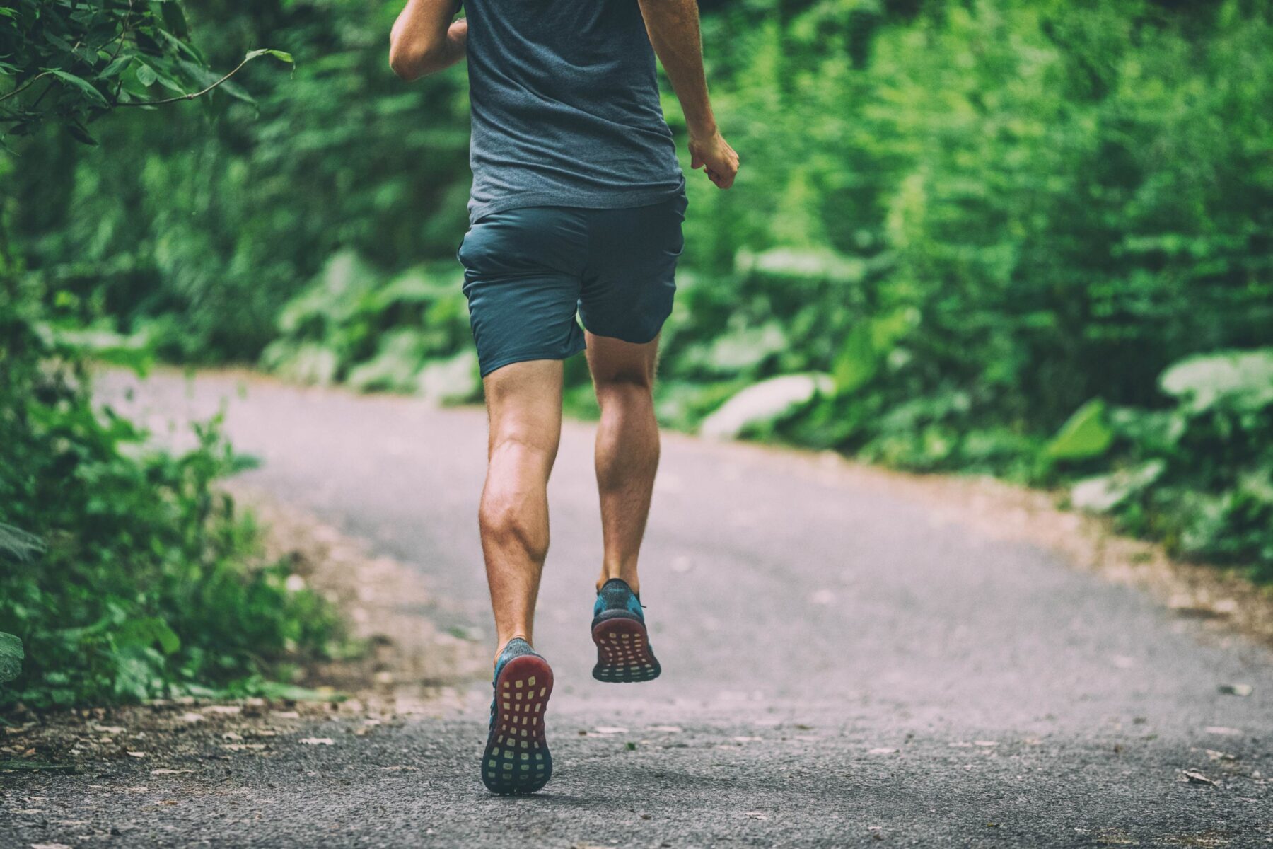 man running on a back road